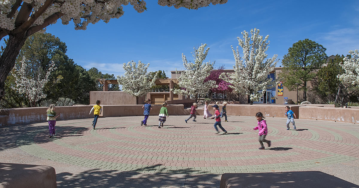 Children play in the labyrinth on Milner Plaza near the entrance to the museum.